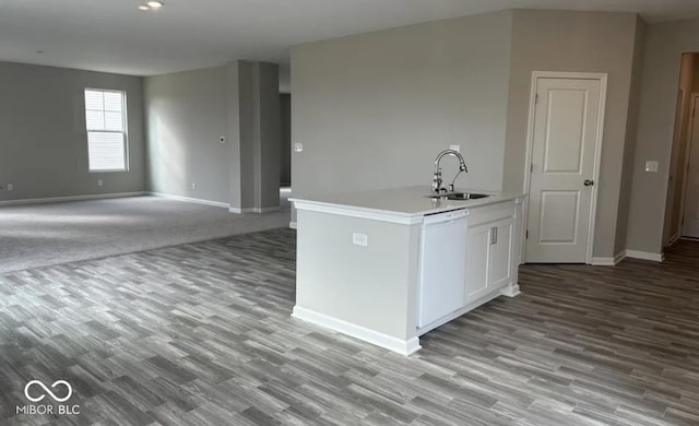 kitchen featuring white cabinetry, sink, dishwasher, and light wood-type flooring