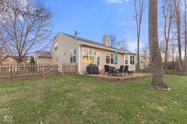 back of house featuring a yard and a patio