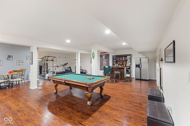 recreation room featuring dark hardwood / wood-style floors, billiards, and bar