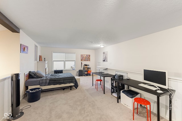 carpeted bedroom with a textured ceiling