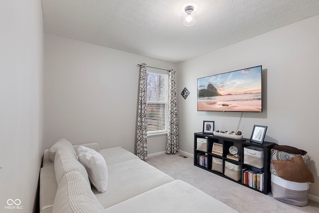 carpeted bedroom with a textured ceiling