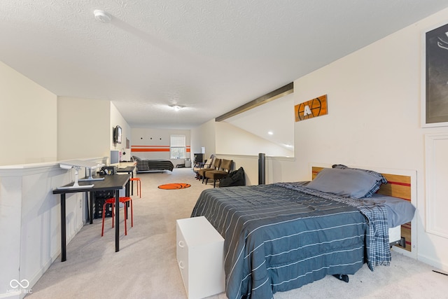 carpeted bedroom featuring lofted ceiling and a textured ceiling