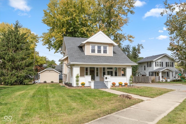 view of front of house featuring covered porch and a front yard