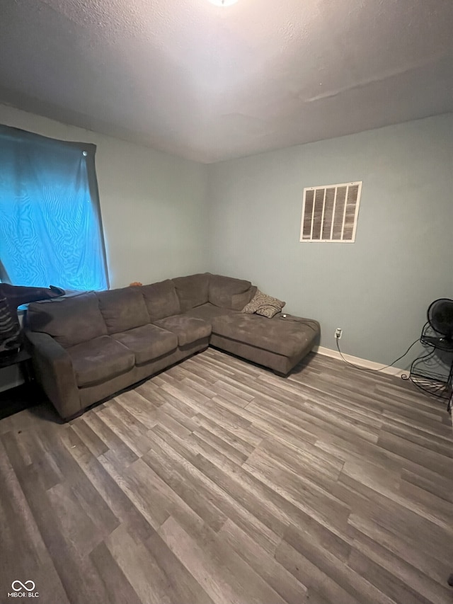 unfurnished living room featuring hardwood / wood-style floors