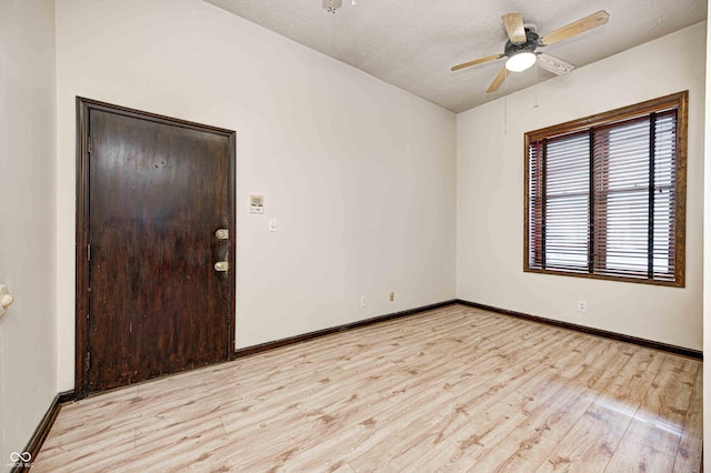 unfurnished room featuring ceiling fan, a textured ceiling, and light hardwood / wood-style flooring