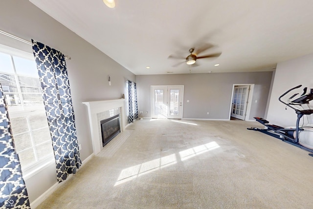 carpeted living area featuring recessed lighting, a fireplace with flush hearth, a ceiling fan, and baseboards