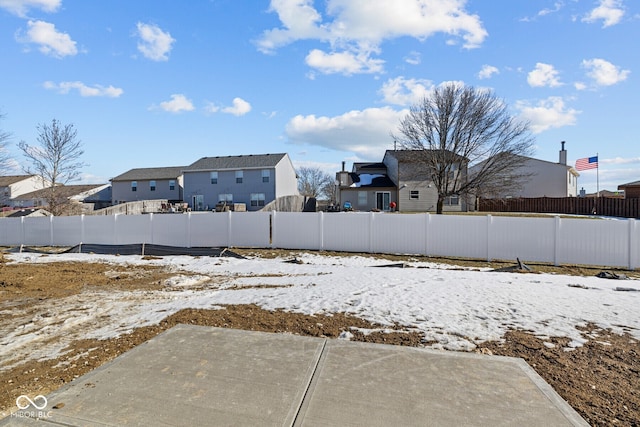 view of yard layered in snow