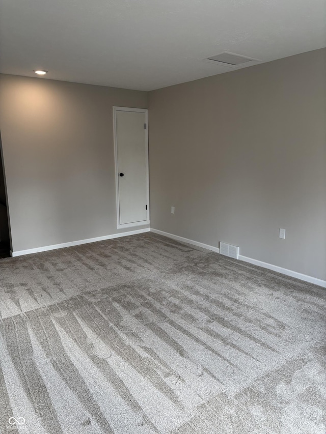 empty room with carpet flooring