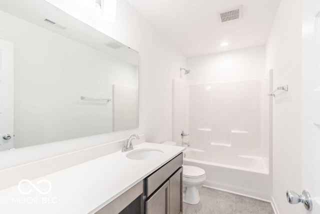 full bathroom featuring tile patterned floors, vanity, toilet, and shower / washtub combination