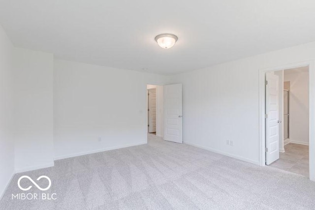 spare room with light carpet