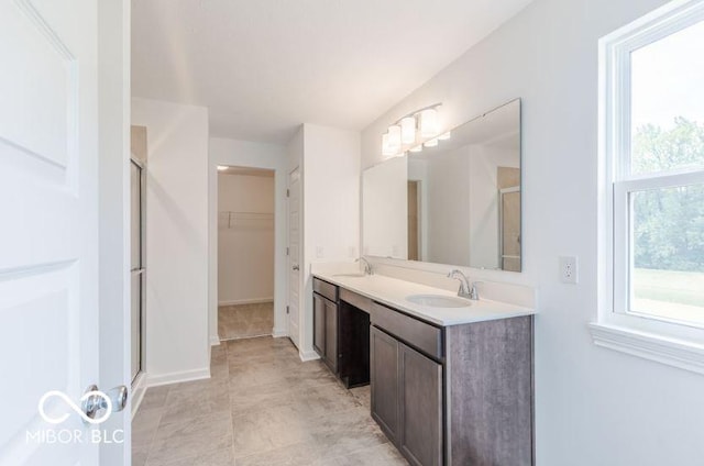 bathroom featuring vanity and walk in shower