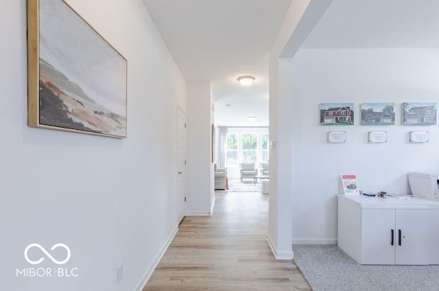 corridor featuring light hardwood / wood-style floors