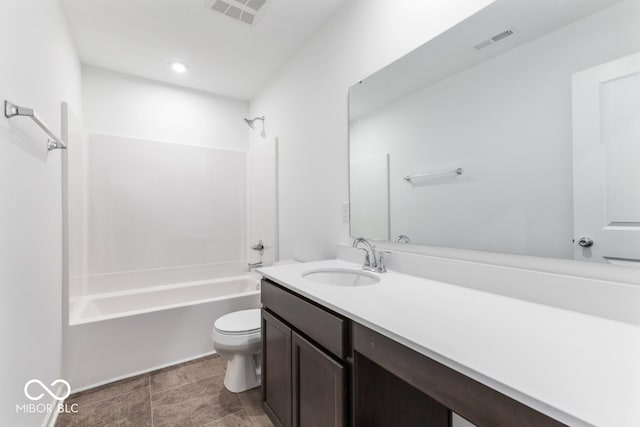 bathroom featuring toilet, shower / washtub combination, vanity, and visible vents