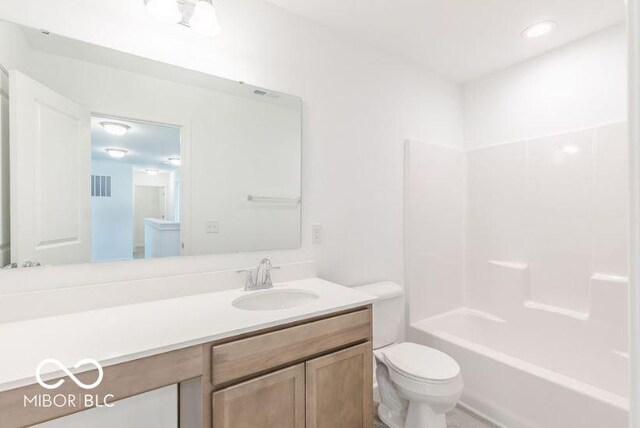 full bathroom with shower / bathing tub combination, vanity, and toilet