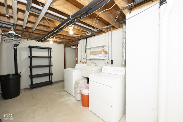 laundry room with washing machine and dryer and sink