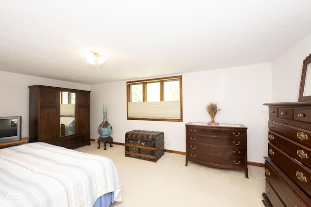 bedroom featuring light colored carpet