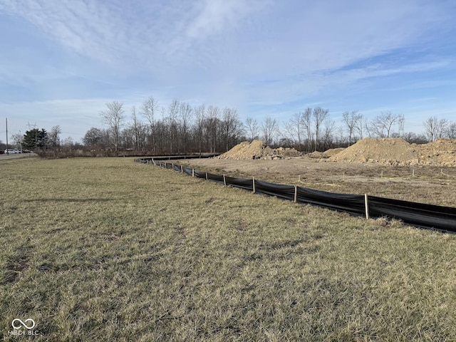 view of yard with a rural view