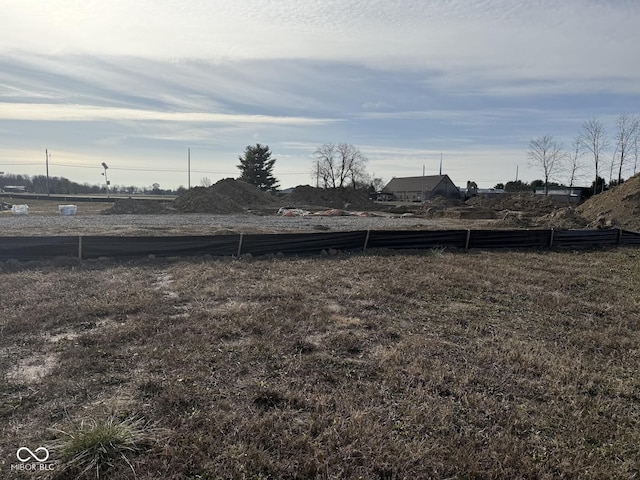 view of yard with a rural view