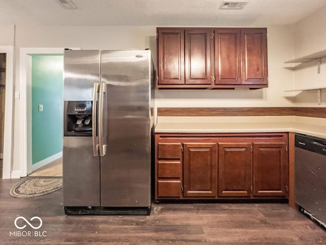 kitchen featuring dark wood-type flooring, appliances with stainless steel finishes, and a textured ceiling