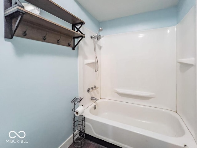 bathroom with washtub / shower combination