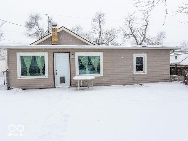 view of snow covered house