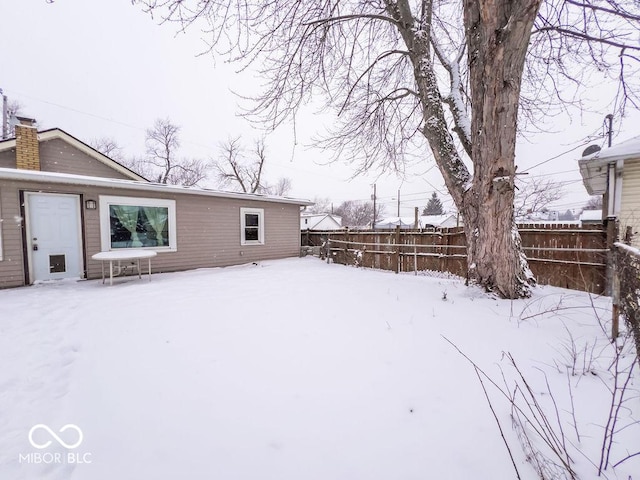 view of yard layered in snow