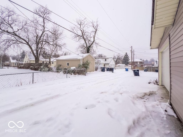 view of yard layered in snow