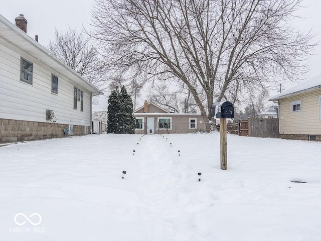 view of yard layered in snow