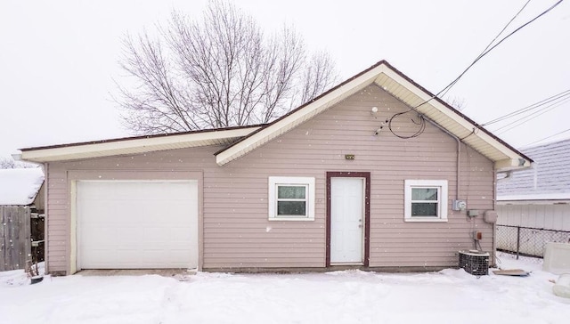 exterior space featuring a garage and central AC unit