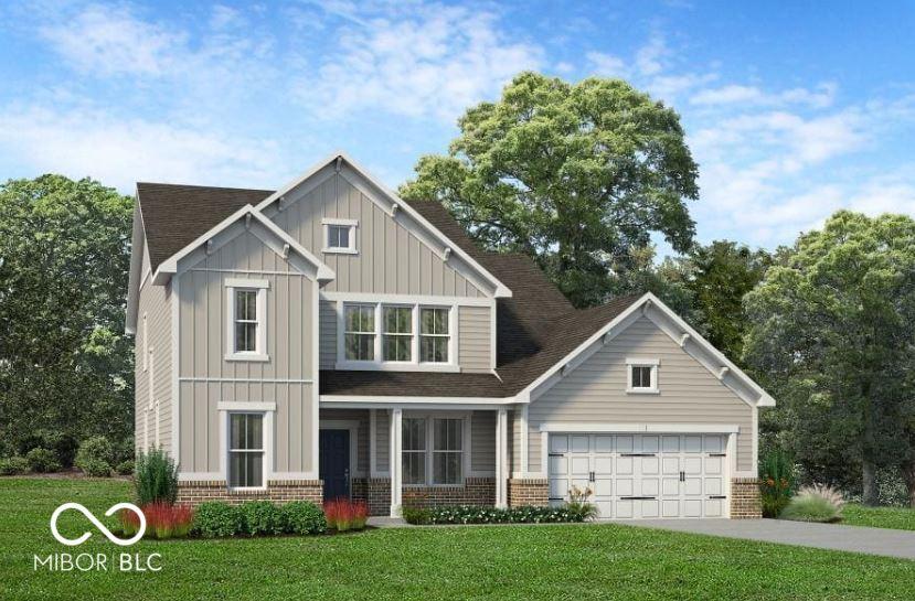 view of front of home featuring a garage and a front yard