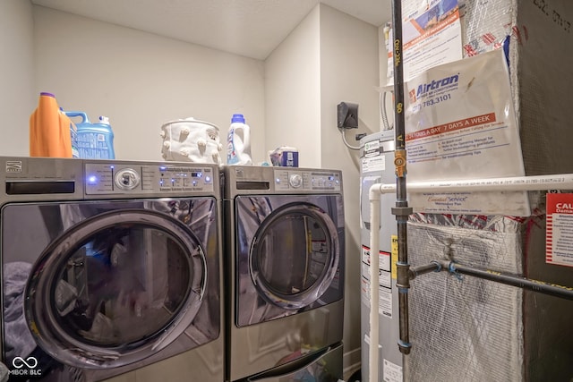 laundry area featuring washing machine and clothes dryer