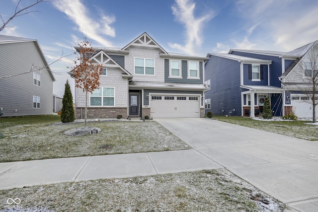 view of front of home with a front yard and a garage