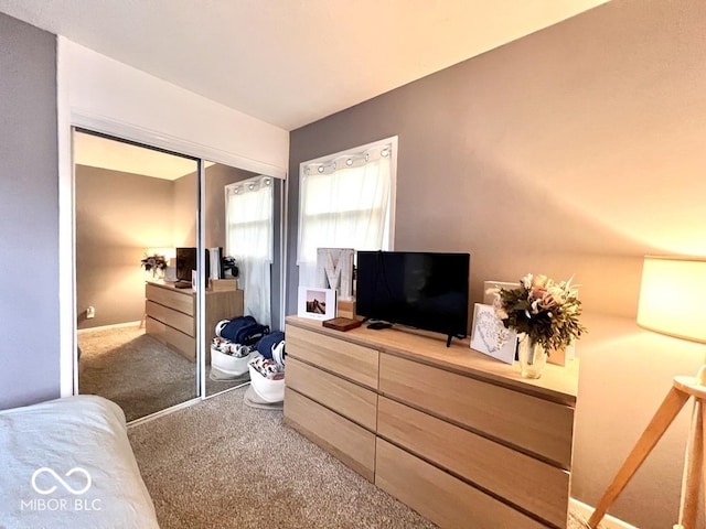 carpeted bedroom featuring a closet