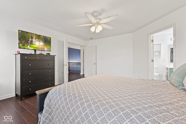 bedroom with ceiling fan, dark hardwood / wood-style flooring, and ensuite bath