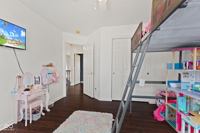 bedroom with ceiling fan and dark wood-type flooring