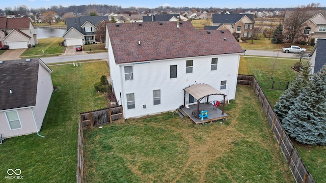 rear view of property featuring a deck with water view