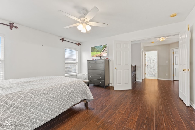 bedroom with ceiling fan and dark hardwood / wood-style floors