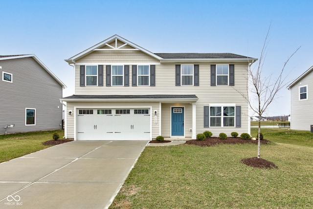 view of front of property featuring a garage and a front yard