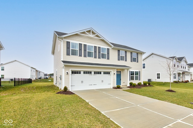 view of front of house with a front yard and a garage