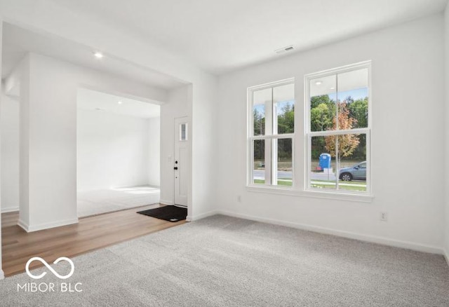 spare room featuring hardwood / wood-style floors