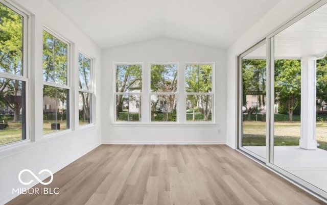 unfurnished sunroom with a healthy amount of sunlight and vaulted ceiling