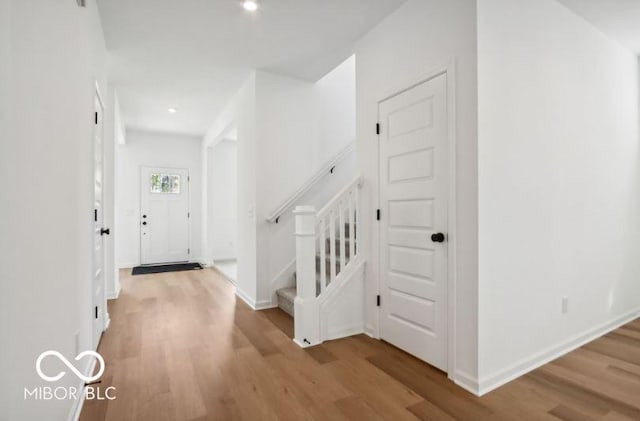 foyer entrance with light hardwood / wood-style flooring