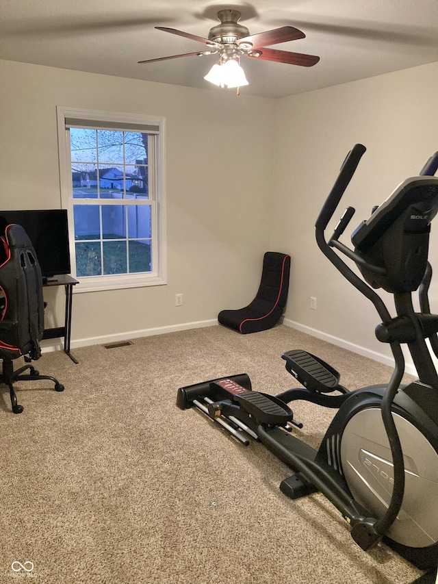 exercise area featuring carpet and ceiling fan