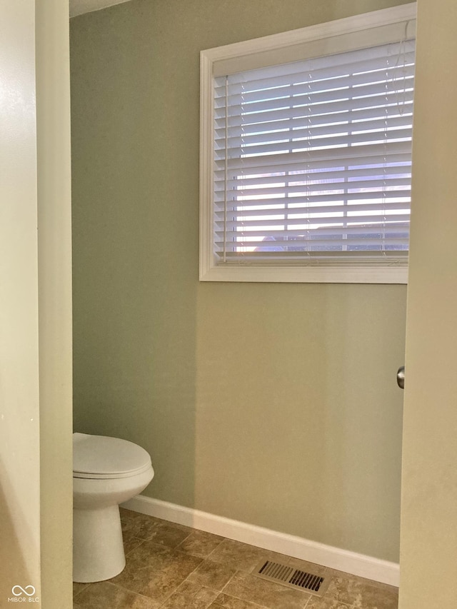 bathroom featuring tile patterned floors and toilet