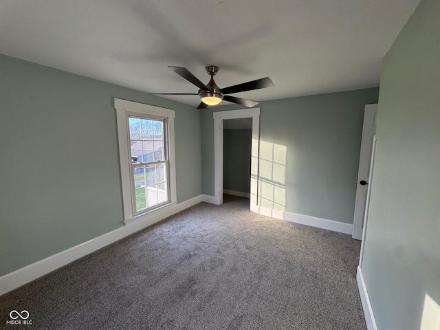 unfurnished bedroom featuring light colored carpet and ceiling fan