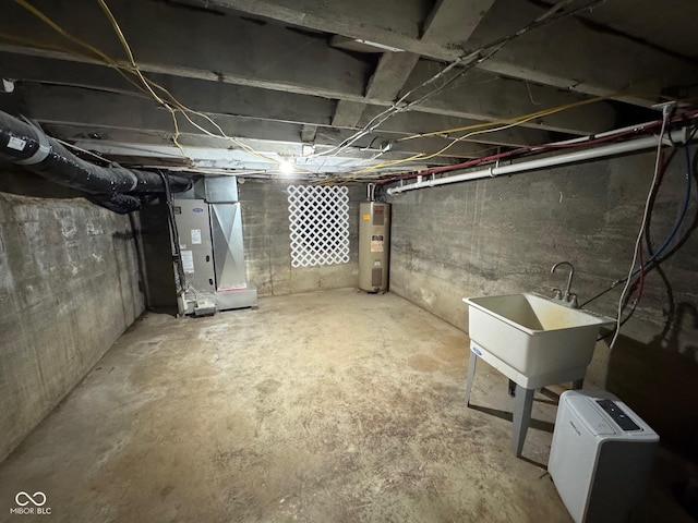 basement with heating unit, water heater, and sink