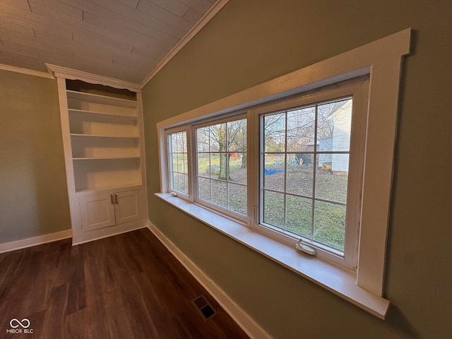 interior space with wood ceiling, built in shelves, wood-type flooring, and ornamental molding