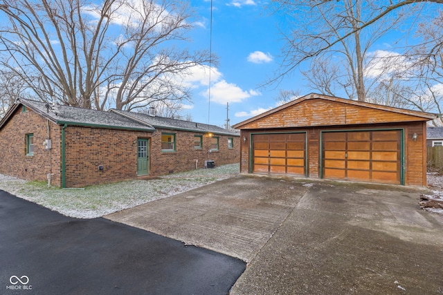 view of property exterior with a garage and an outdoor structure