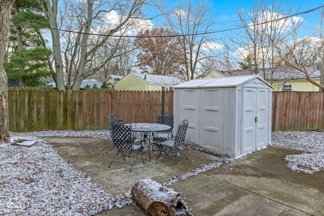 view of patio / terrace featuring a storage shed