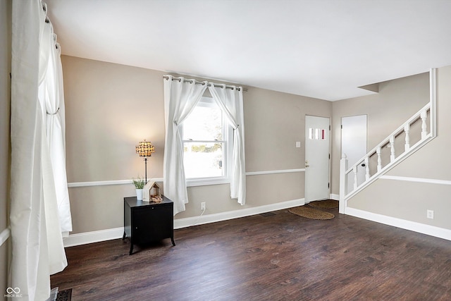 entrance foyer with dark hardwood / wood-style floors